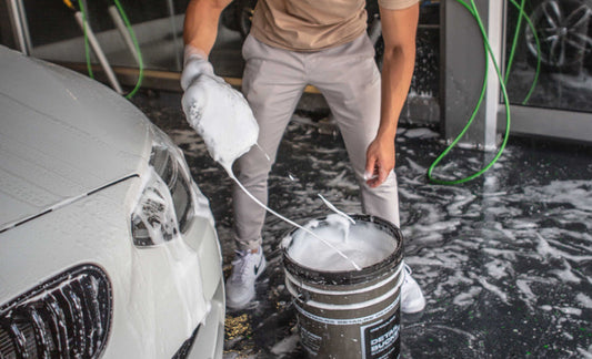 A man is washing his car